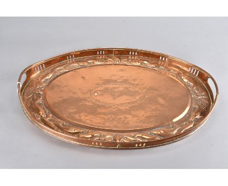 A Newlyn copper arts and crafts twin handled oval tray, with pierced gallery and raised handles, the edge decorated with fish