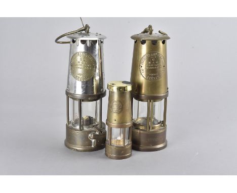 Two Protector Lamp & Lighting miners lamps, one Type SL the other Type 6, by M & Q, together with a smaller example converted