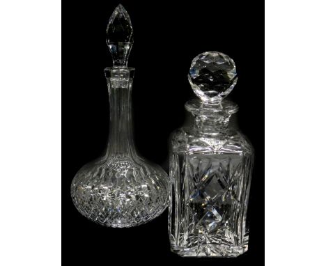 A square section cut glass decanter and stopper, and a bottle shaped decanter with faceted stopper. (2)