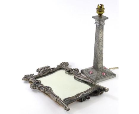 A late 19thC Art Nouveau style silver plated copper dressing mirror, with a bevelled plate and a strut support to the reverse