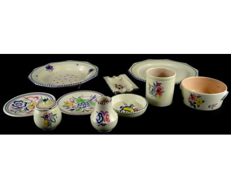 A collection of Poole Pottery, each piece decorated with flower sprays in a typical style, printed marks to underside.