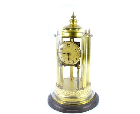 A Portico shaped brass Anniversary clock, with paper dial with Arabic numerals, within glass dome, 45cm high.