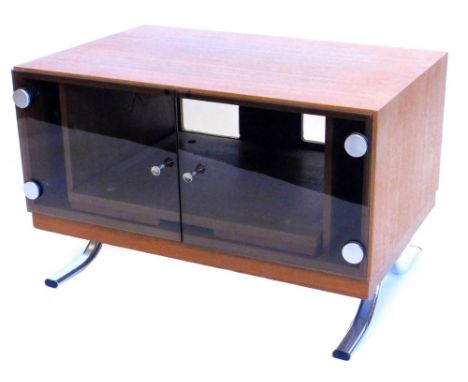 A 1970's/80's Danish style teak television stand, with two smoked glass doors, each with brushed finish metal and plastic hin