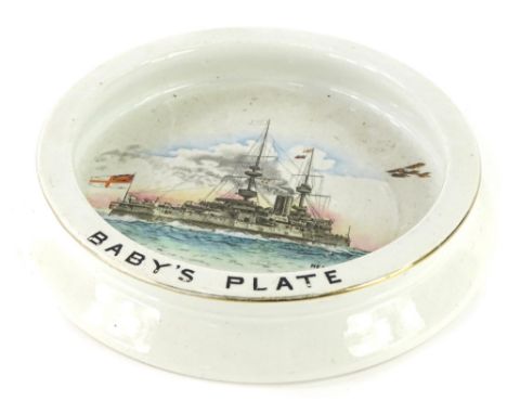 A Shelley ceramic baby's plate, printed and hand painted to the interior with a naval war ship, aeroplane, etc., titled Ready