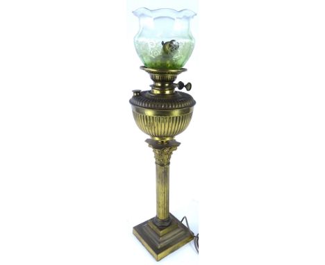 A late 19th/early 20thC brass Corinthian column oil lamp, on a square step base and a frosted green shade, converted to elect