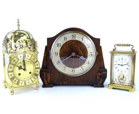 Three clocks, to include a presentation lantern type clock, an Art Deco mantel clock and a Schatz carriage type clock.