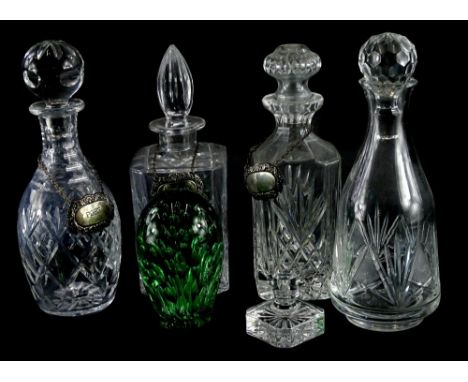 A collection of four late 20thC cut glass decanters, to include square section examples, with three silver plated decanter la