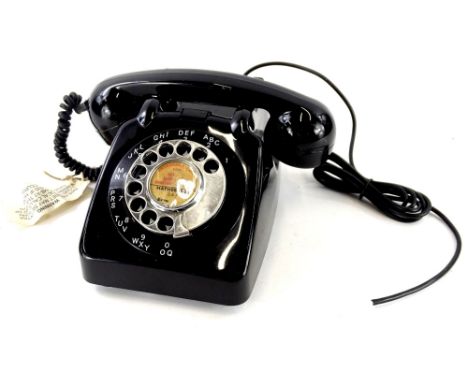 A 1960's GPO model 706 black vintage telephone, unusually fitted with a chrome dial and handle with bell on/off switch and an