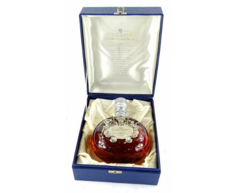 A Whyte &amp; Mackay delux 12 year old blended scotch whisky decanter, made to commemorate the marriage of Prince of Wales an