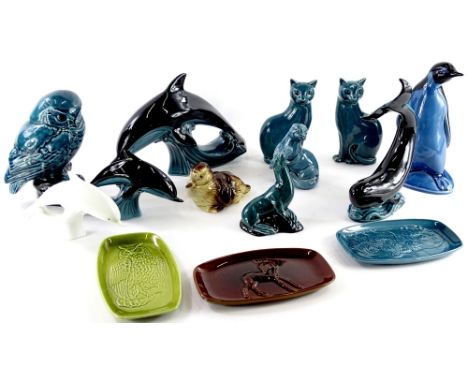 A collection of Poole Pottery animals, to include a duckling, otter, a pair of Siamese type cats, dolphins, owl, etc. 