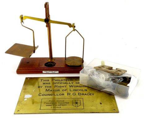 A set of brassed metal scales, with plaque for Arnold Precision Scales, various weights and a Lincoln Post Office counter ope
