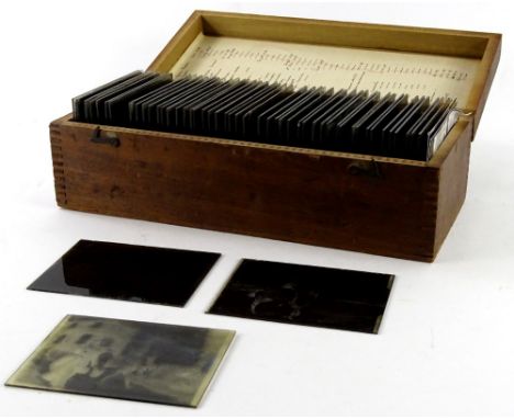A collection of glass negatives or magic lantern slides, each depicting late 19th/early 20thC figures, scenes, etc.