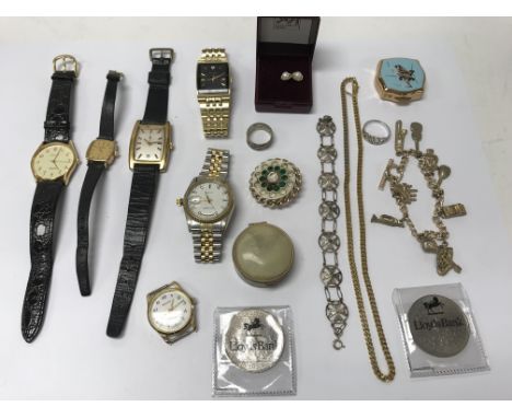 A box containing vintage watches, quartz watches and other oddments.