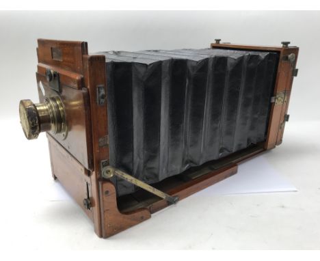 A mahogany and brass Victorian half plate camera made by Lancaster & Sons.
