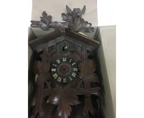 A carved cuckoo clock for repair