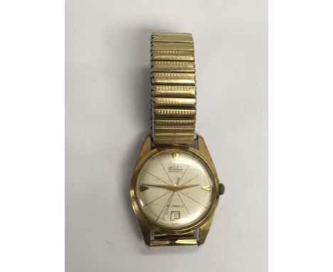 A vintage gents gold tone Milex automatic wristwatch with date aperture and expanding strap.