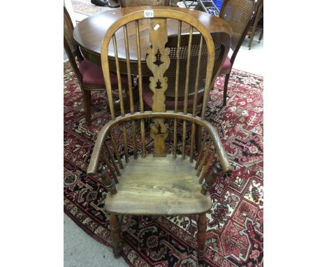 A elm stick back chair with solid seat on turned legs