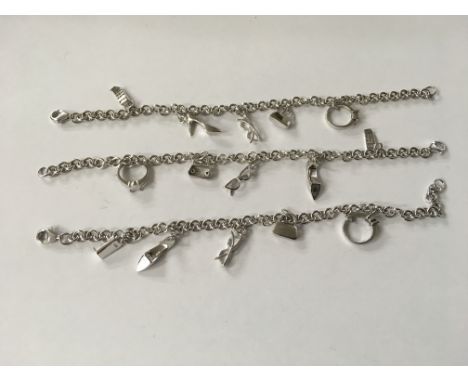 Three sterling silver charm bracelets.