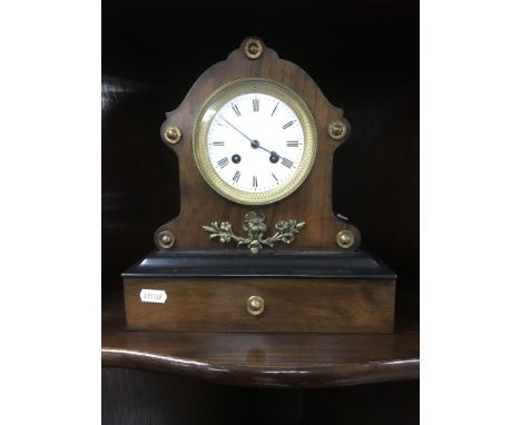 A French mahogany mantle clock the enamel dial with Roman numerals and the case with applied gilt metal mounts