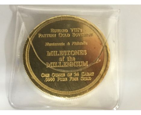 A Gold Coin 24 carat .999 one ounce, the coin with a portrait of Edward Vll milestones of the millennium.