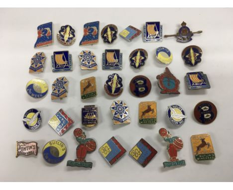 A collection of vintage enamel Butlin's badges.