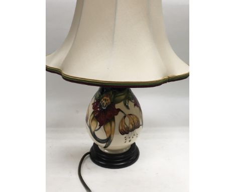 A Moorcroft lamp in Anna Lily pattern, approx total height 45cm.