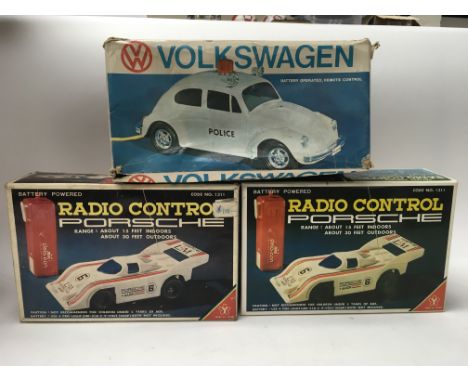 Two boxed radio controlled Porsche’s, a fire engine, a Volkswagen police car, a mighty express and a Surrey rider. 
