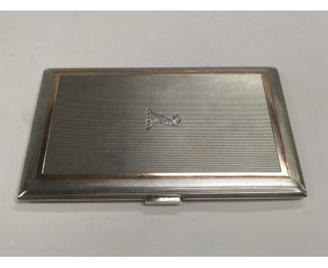 A silver cigarette case with engine turned decoration, Birmingham 1963.