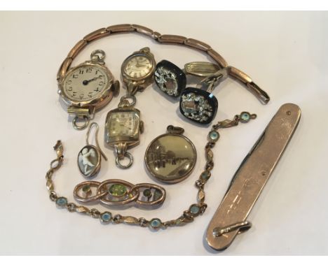 A collection of Gold oddments comprising ladies Vintage wrist watches a gold mounted pocket knife a brooch and other oddments