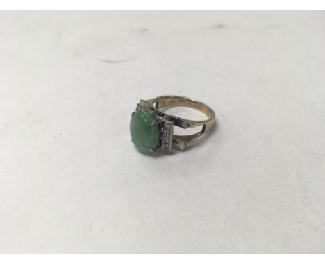 A 14ct gold jade ring. Weight approx 5.9g, size approx N.