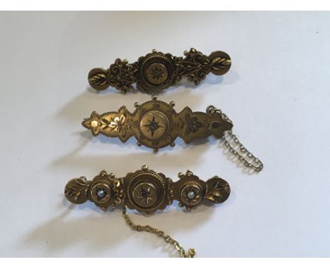 Three Vintage Gold brooches set with diamonds and seed pearl two 15ct (9g) and one 9ct (3g)