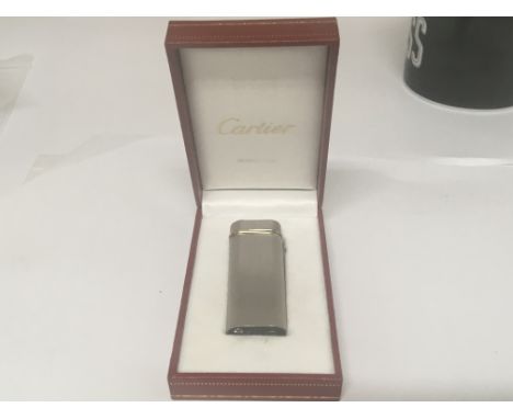 A Quality Cartier silvered lighter in a fitted case,