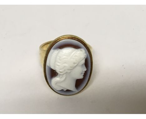 An 18ct Gold ring set with an oval portrait cameo of neo classical design, total weight 10g ring size Q.