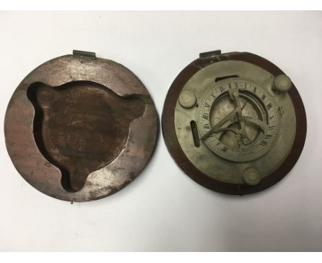 A Charles nephew & Co Calcutta travelling compass mounted in a mahogany case.