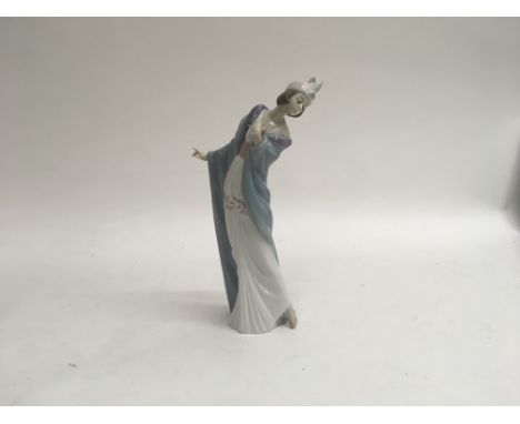 A Lladro figure of a well dressed women titled “The Flirt” with original box, approximately 25cm high together with a Nao fig