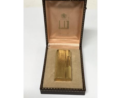 A Gold plated Dunhill lighter in a fitted box, working order.
