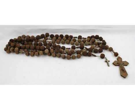 TWO NATIVE CARVED WOOD ROSARIES, each with multiple beads and chain links, 2.2m long and 1.6m long 