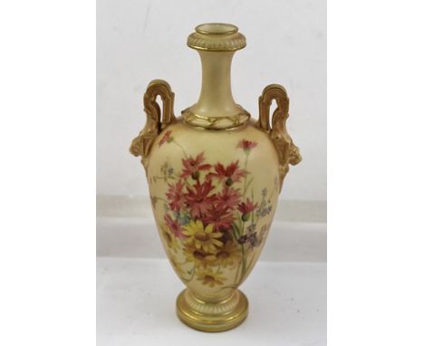 A ROYAL WORCESTER PORCELAIN VASE of blush ivory ground, with lion mask applied handles, hand painted decoration depicting sum