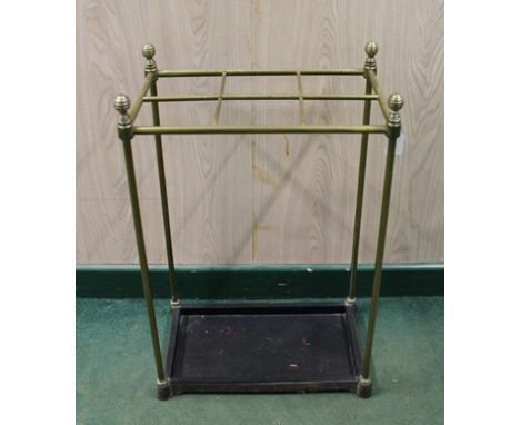 A BRASS STICK/UMBRELLA STAND with metal drip tray 