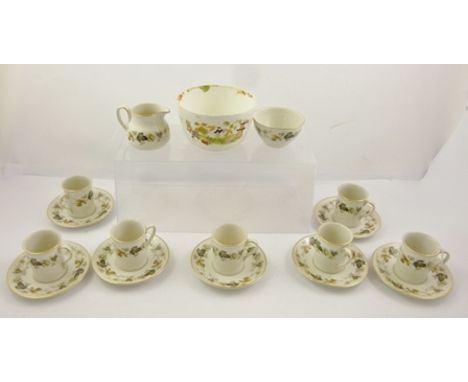 A ROYAL DOULTON "LARCHMONT" PATTERN PART COFFEE SERVICE, comprising seven coffee cans with saucers, cream jug and sugar bowl,