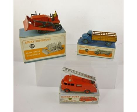 DINKY SUPERTOYS A LEYLAND COMET LORRY no. 531, a FIRE ENGINE with extending ladder no. 555, and a BLAW KNOX BULLDOZER no. 561
