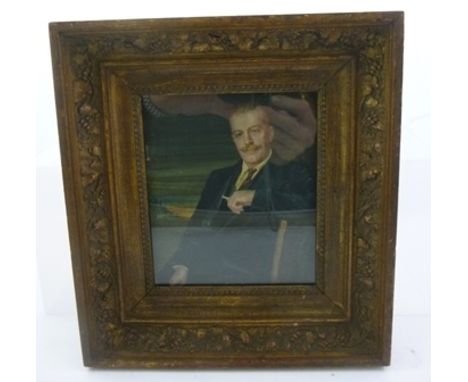 A MINIATURE PORTRAIT ON IVORY OF A SEATED GENTLEMAN, depicted in a suit, smoking, 15cm x 12.5cm in gilt glazed frame, inscrib