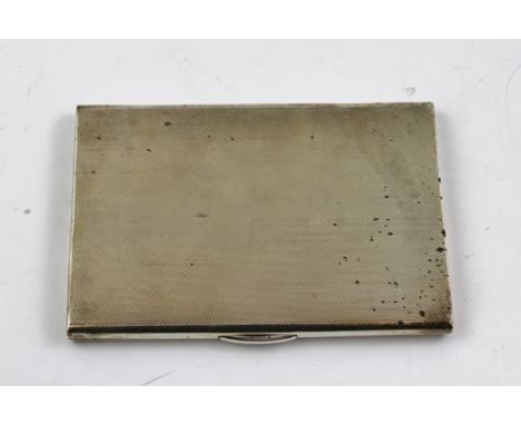 WILLIAM SUCKLING LTD. A RECTANGULAR SILVER CIGARETTE CASE, having engine turned exterior and gilded interior, un-engraved, Bi