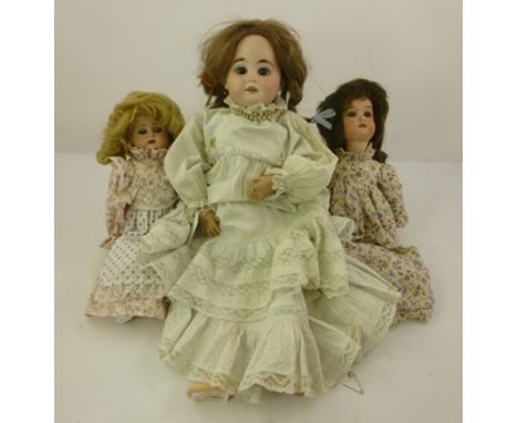 AN EARLY 20TH CENTURY KAMMER &amp; REINHARDT BISQUE HEADED DOLL, having mobile eyes and open mouth, on jointed composition bo