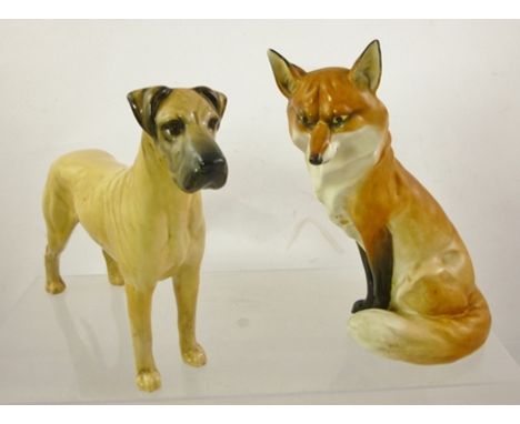 A ROYAL WORCESTER PORCELAIN MODEL OF A SEATED FOX, ref. 2993, 18cm high, and a Beswick earthenware MODEL OF A GREAT DANE, 17c