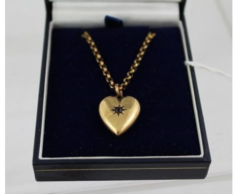 A VICTORIAN 9CT GOLD LOCKET with single central stone, on a 9ct gold belcher chain with clasp 