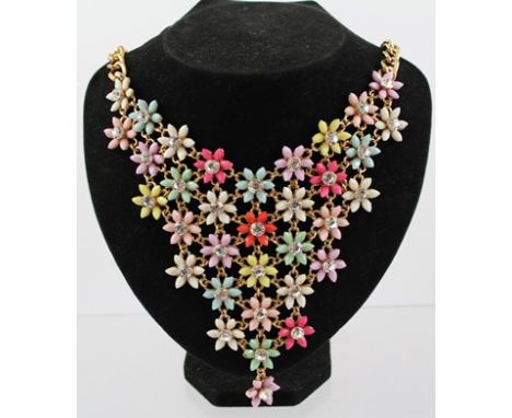 A GILT METAL AND ENAMEL DIAMANTE SET COLLAR with hammered curb link chain 