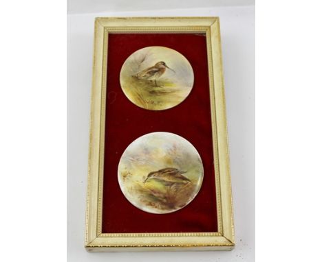 TWO ROYAL WORCESTER JAMES STINTON HAND-PAINTED PORCELAIN PLAQUES, Woodcock in landscapes, signed, one 5cm diameter, the other