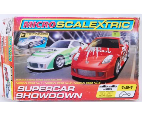 SCALEXTRIC; A Micro Scalextric set ' Super Car Showdown ' within the original box. 
