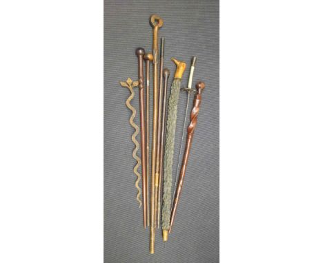A collection of African sticks and one Polynesian stick, together with a sword (9)
